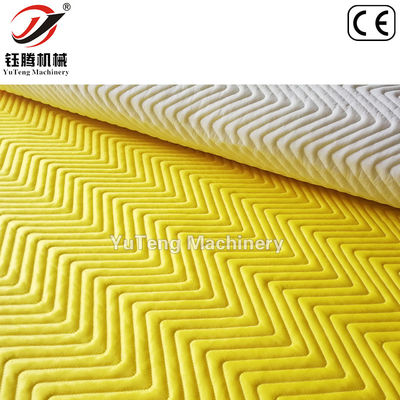 Máquina para cubrir computadoras con lanzadera de agujas múltiples